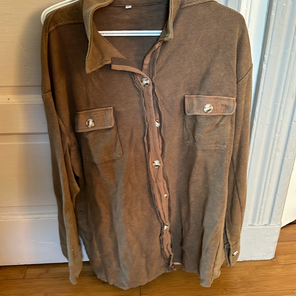 Brown long sleeve button up waffle knit shirt.